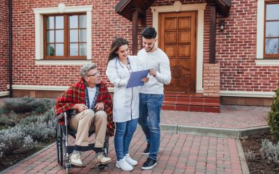 son-with-nurse-speaking-about-old-man-whelchair-looking-his-results_496169-749